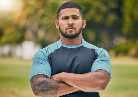 Rugby, field and portrait of confident man with serious expression, confidence and pride in winning game. Fitness, sports and proud face of player at match, workout or competition on grass at stadiumの写真素材