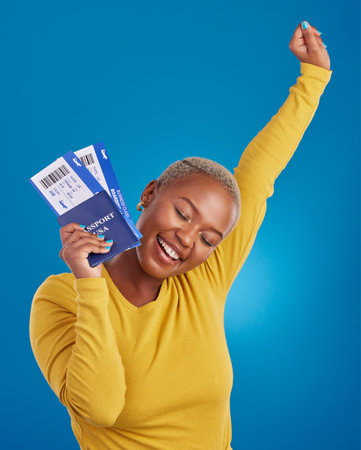 Excited, travel passport and black woman in studio on blue background with flight documents, tickets and ID. Traveling mockup, happy and girl celebrate immigration, holiday and international vacationの写真素材