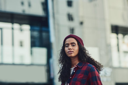 Urban living is what Im about. an attractive young woman in the city.の写真素材