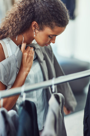 This looks like it will go together. an attractive young woman on a shopping spree in a boutique.の写真素材