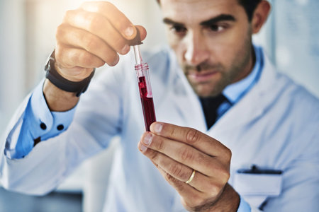 Scrutinizing the sample. a scientist analyzing medical samples in a lab.の写真素材