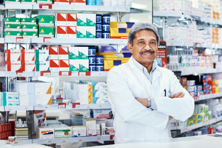 Were the pharmacy of choice for many. Portrait of a mature pharmacist working in a chemist.の写真素材