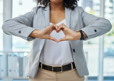 Business woman, fingers and heart hands for corporate customer care, client support or leadership trust. Worker, employee or hand gesture for love, sign or emoji symbol for wellness, vote or CRM hopeの写真素材
