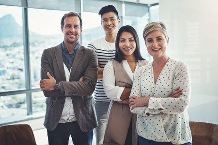 Here to level up on our success together. Portrait of a diverse group of businesspeople standing in...