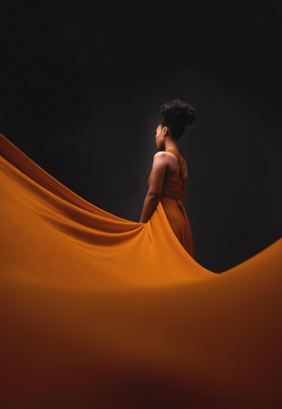 Black woman, art and fashion, fabric with mockup on dark background with beauty and aesthetic movement. Flowing silk, fantasy and artistic African model in creative designer dress in studio from backの写真素材