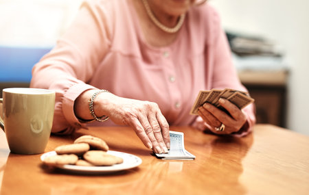 working on her card game. an unrecognizable senior woman in playing cards in an old age home.