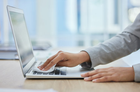 Woman hands, laptop or cleaning cloth for hygiene, wellness or bacteria protection in corporate...