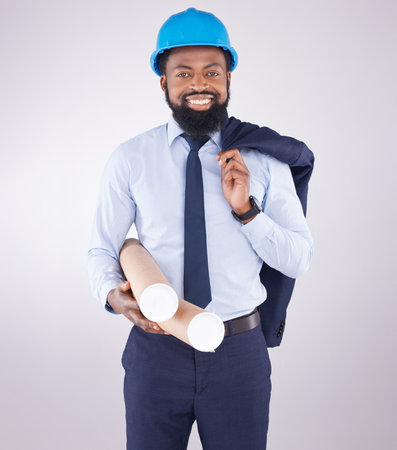 Black man, architect and studio portrait with blueprint for design, project and property by white background. African architecture engineer, smile and excited face for real estate constructionの写真素材