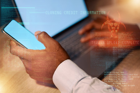 Man, laptop and hands with phone in cyber attack, trojan virus or cybersecurity at night on mockup screen. Hand of male hacker working late on smartphone or computer display for internet fraud or appの写真素材