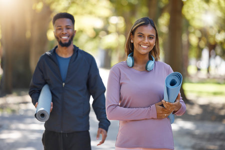 Fitness, couple and portrait smile for yoga, spiritual wellness or healthy exercise together in nature. Happy woman and man yogi smiling with mat for calm zen training, practice or workout at a parkの写真素材