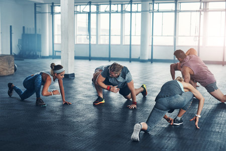 Putting in the work for a healthier life. an accountability group working out at the gym.