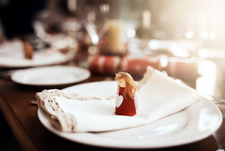 Well keep your spot open at our table. Closeup shot of a place setting on a table at Christmas.の写真素材