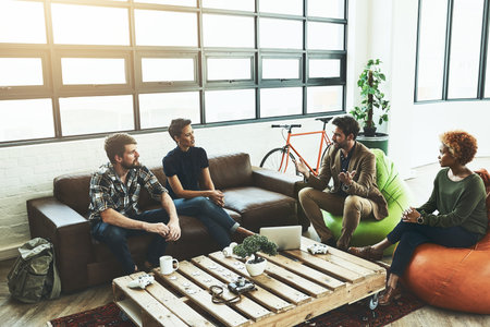 Planning is the first step. a group of young designers having a discussion in a modern office.