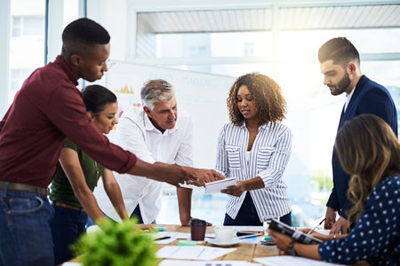 Some call it an office, we call it creativity. a group of creative employees working in a modern office.の写真素材