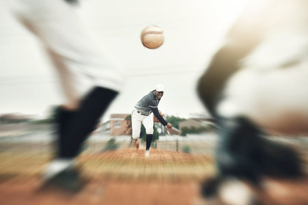 Baseball, fast ball and sport athlete throwing in a sport, exercise and workout training in a game. Fitness, sports and teamwork cardio of a baseball player with a team together on a outdoor fieldの写真素材