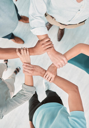 Business team, hands and teamwork collaboration together in shape from above. Corporate men support, trust and hope motivation success working in office, unity, commitment and union careの写真素材