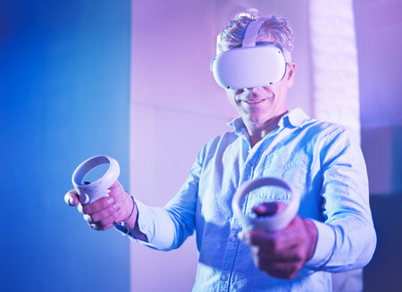 Metaverse, virtual reality headset or gaming console for mature man in neon house, home and studio....