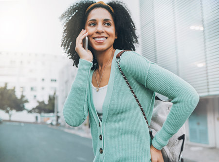 Phone call, smile or black woman in city, street or travel with communication, networking or 5g network outdoor. London, tech or girl happy with smartphone walking, commute or traveling with backpackの写真素材