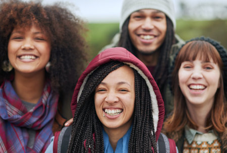 Well remember the memories we make today forever. Portrait of a group of happy friends posing together outside.の写真素材