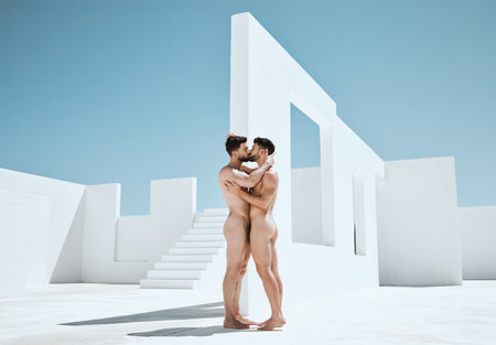Art, creativity and kiss, naked men together in lgbt embrace with sun, Greek architecture and photography. Creative pride, artistic body hug and aesthetic love, nude gay couple kissing with blue sky.の写真素材