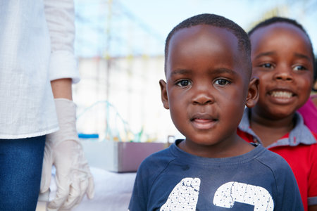 Too cute for words. kids at a community outreach event.の写真素材