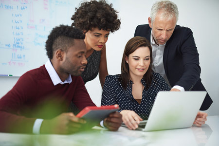Discover new high-tech solutions to help your company grow. a group of businesspeople discussing...