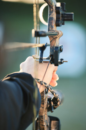 Sports archer, hands and bow and arrow training for archery competition, athlete challenge or girl...