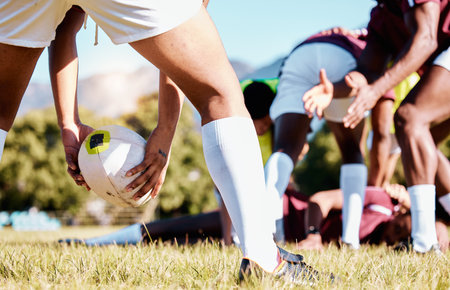 Ball, scrum or hands of rugby men in training, exercise or workout match on sports field in practice. Team work, strong man or powerful group in tough competitive game with physical fitness or effortの写真素材