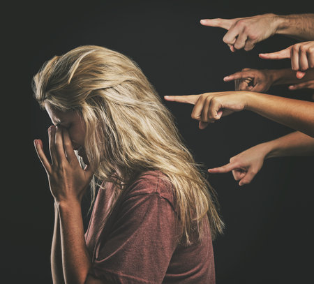 People judge depressed young woman, fear social anxiety and mental health burnout with fingers point at sad girl. Stressed person frustrated, emotional headache from failure and social bullyingの写真素材