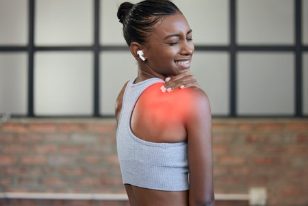 Fitness, injury or woman with back pain at gym after exercising, body training accident in workout....