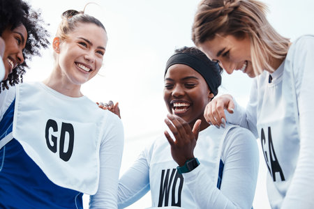 Netball, women or happy group with sports team building, funny conversation and support for training or practice. Athlete friends, people or gen z excited for outdoor game in diversity circle talkingの写真素材