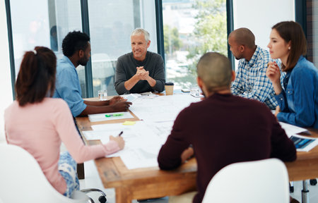 Be the architect of your own future. a group of architects in the boardroom.の写真素材