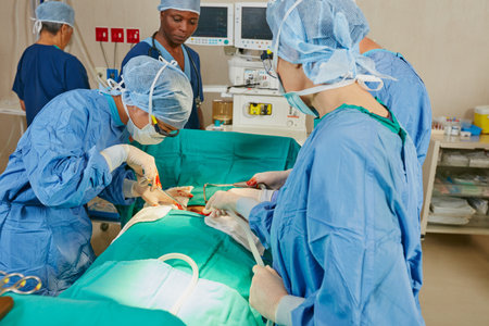 Dedicated to saving lives. a team of surgeons performing a surgery in an operating room.の写真素材