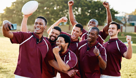 Rugby, success or happy team in selfie to celebrate goals, achievement or group victory together on field. Men, winner or excited sports athletes take photo for winning a competition or tournamentの写真素材
