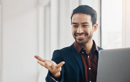 Man, hand and invisible space in office with laptop for mockup with happiness, email and agenda. Asian entrepreneur, businessman and happy with computer for mock up, product placement and visionの写真素材