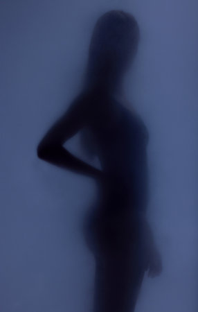 Woman silhouette, glass and sexy shadow with creative art deco, screen and natural body health. Girl, model and mockup by window with smoke, dark aesthetic and sensual mystery with wellness of personの写真素材