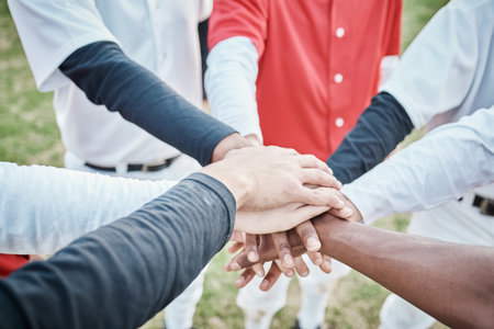 Hands, motivation or baseball people in huddle with support, hope or faith on sports field in game together. Closeup of teamwork, collaboration or group of softball athletes with goals or solidarityの写真素材
