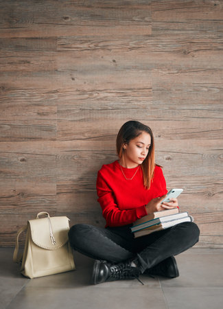 Education, college and a woman with a phone for social media, communication and school app. Contact,...