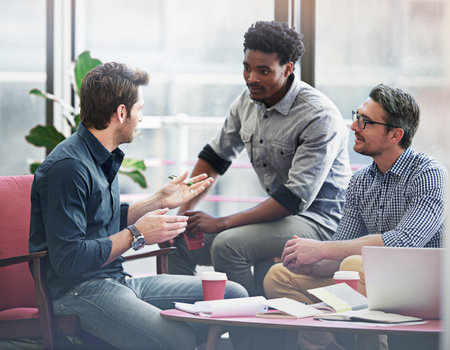 Theyre solution focused. a group of coworkers in a meeting in an office.の写真素材