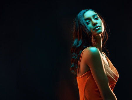 Green light style, dark background mockup and woman portrait with beauty, glowing skin and art aesthetic. Creative neon lighting, young female and model in a studio with modern luxury with mockupの写真素材