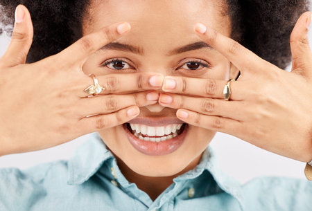 Portrait, eyes and hands with a woman in studio, feeling playful or joking for comedy and humor....