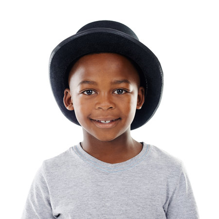 Hes a cool kid. Studio shot of a cute little boy wearing a funky hat against a white background.の写真素材
