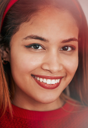 Happy, smile and portrait of woman in studio for natural, satisfaction and youth. Happiness, relax and cool with face of female model smiling on background for elegant, lens flare and glowの写真素材