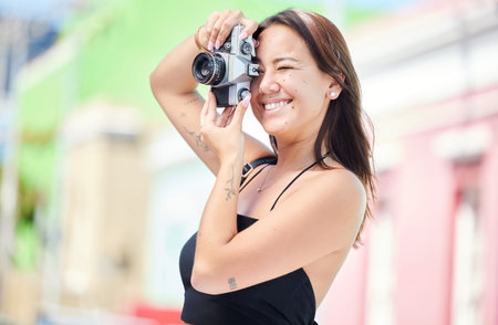 Photographer with digital camera, urban photography or woman shooting Singapore color street on global travel vacation. Asian city girl, holiday memory photoshoot or young gen z student on world tourの写真素材