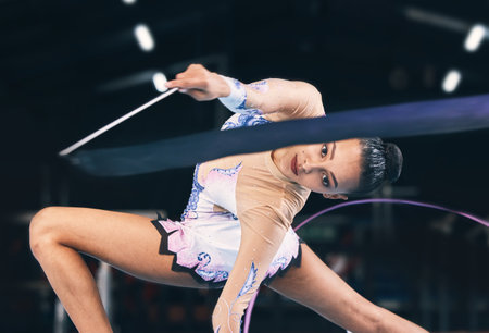 Ribbon gymnastics, woman and portrait in performance, dance training and sports competition. Female, rhythmic movement and flexible dancing athlete, balance action or creative talent in concert eventの写真素材