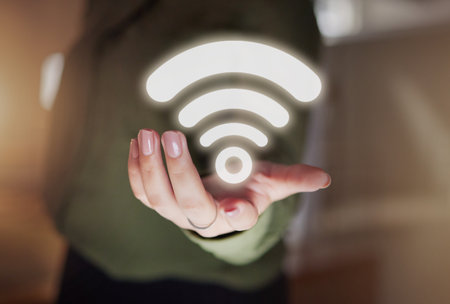 Woman hands, hotspot and wireless icon for network, signal and connection to technology, internet and website media. Closeup of digital connectivity, symbol and transmission of online data hologramの写真素材