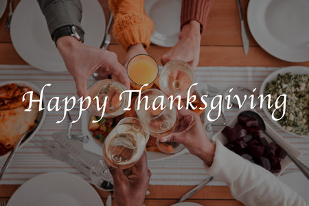 People, hands and cheers for happy thanksgiving dinner, fine dining or celebration above for meal together. Hand of family or friends toasting by table for food, eating or bonding to special occasionの写真素材