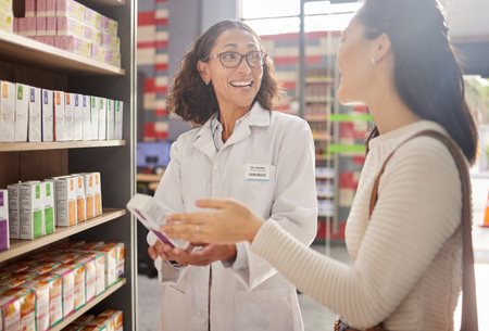 Happy woman, medicine shopping or pharmacist in pharmacy for retail healthcare information. Trust, women or friendly doctor helping a customer with store medication advice, pills or medical drugsの写真素材