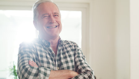 Just wait until you get get old...a happy senior man spending the day at home.の写真素材