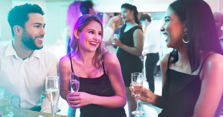 The kind of people every party needs. a group of young friends having fun at a nightclub.の写真素材